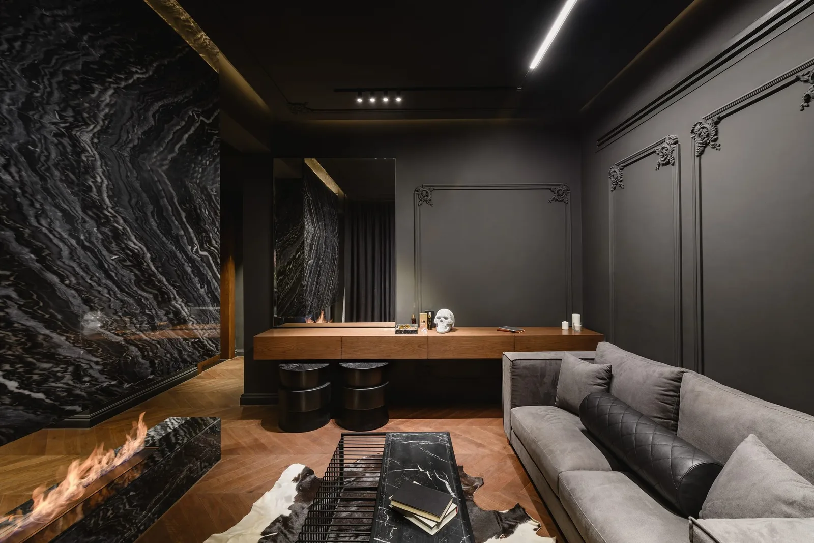 La Feuille Blanche — Study lounge with marble wall and fireplace
