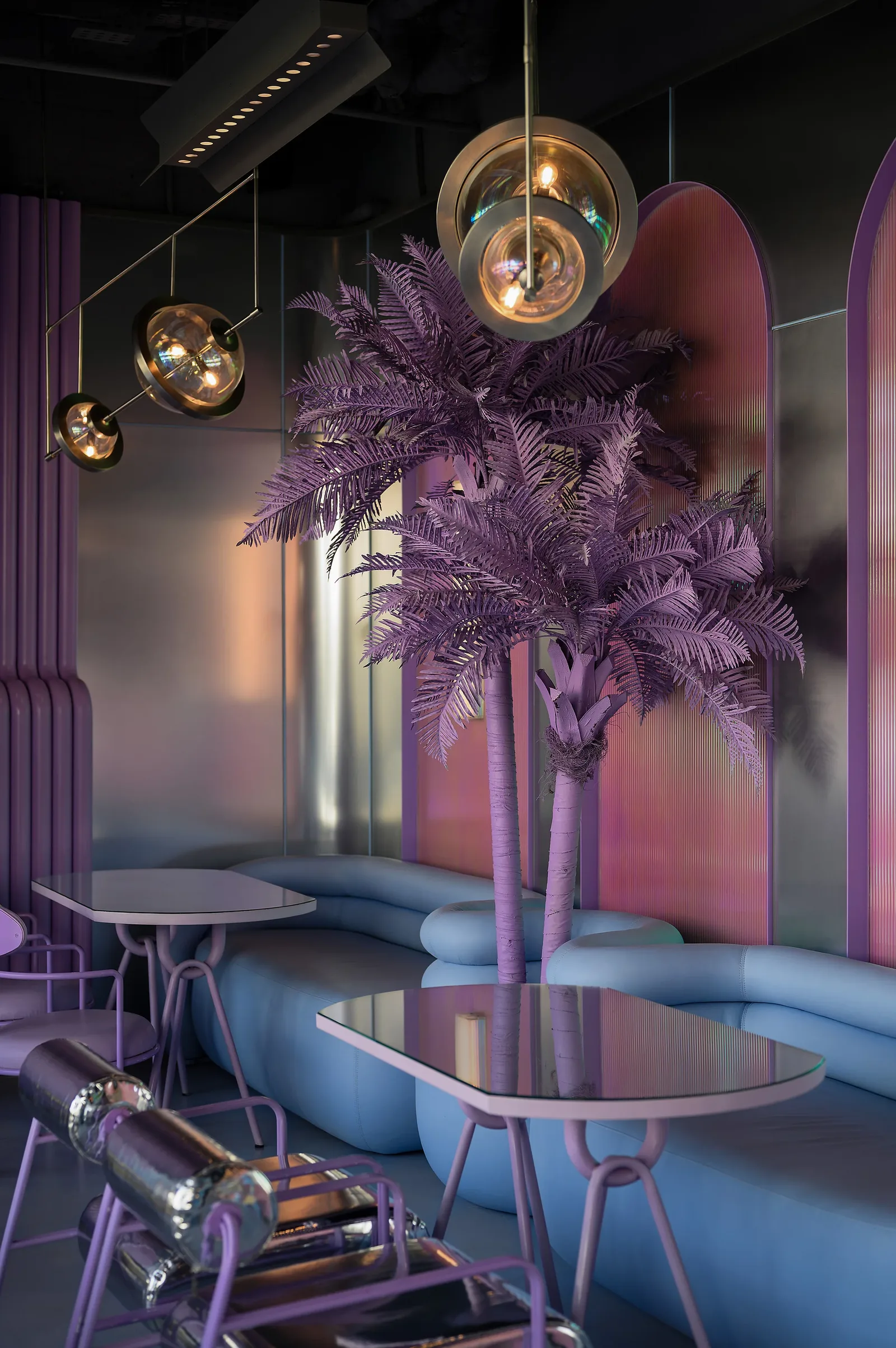 Talkback — Light-blue couch beneath violet palms