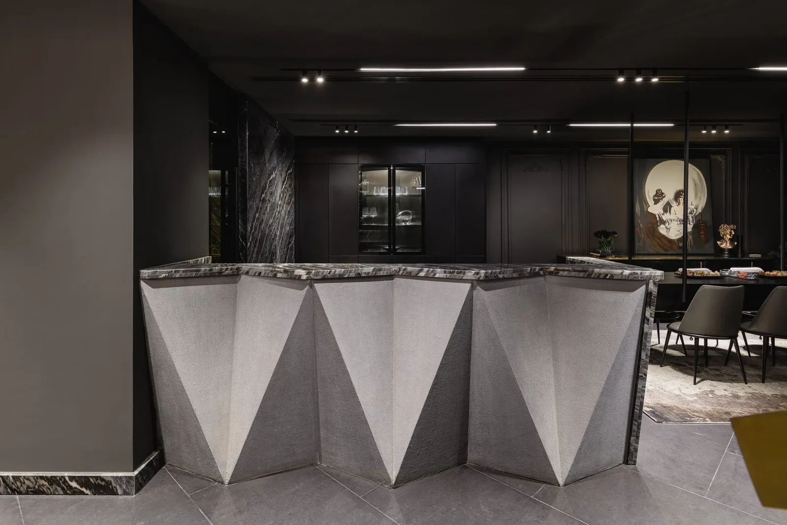 La Feuille Blanche — Faceted stone bar with the dining room beyond