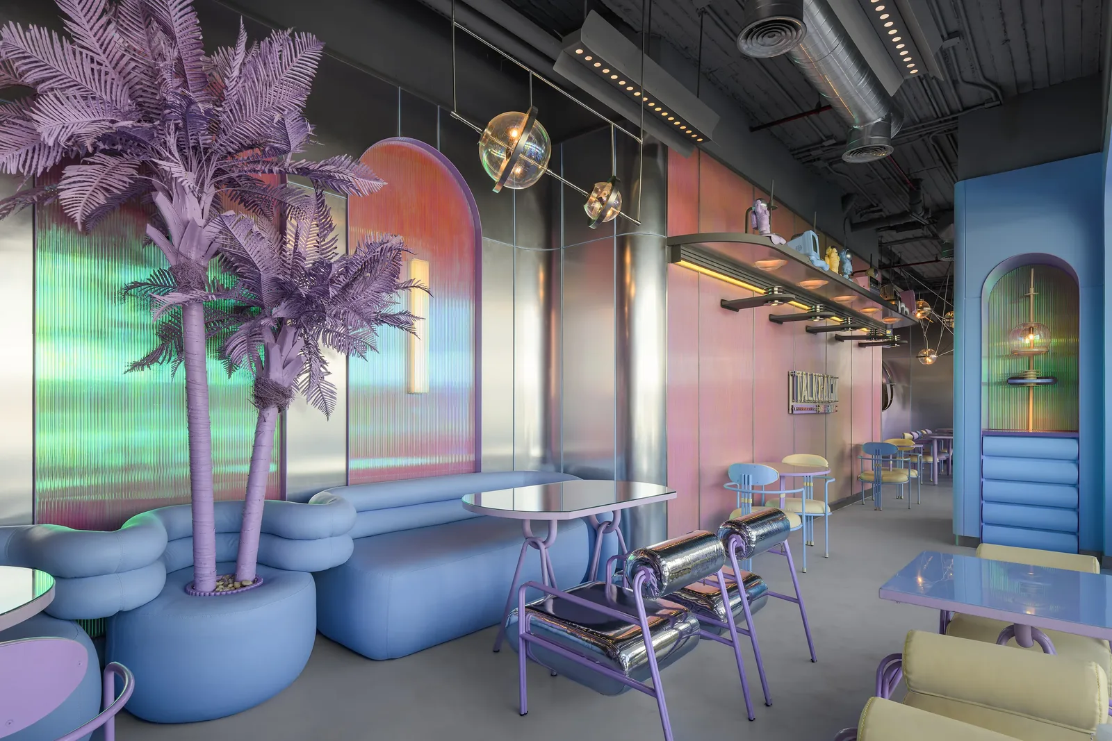 Talkback — Dining room beneath violet palms and iridescent ribbed glass