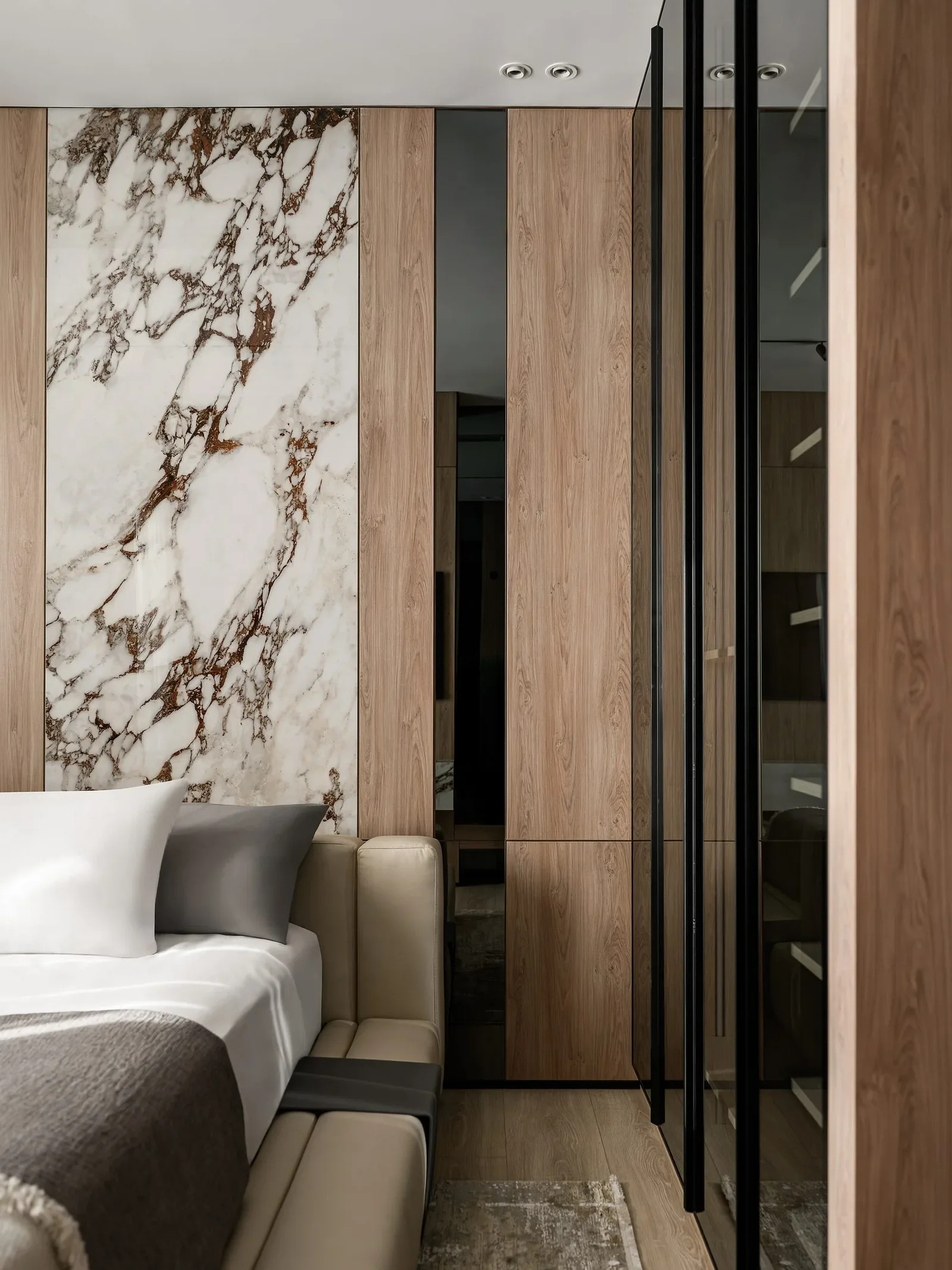 JW Marriott Residences — Bedroom with marble panel and full-height wardrobes