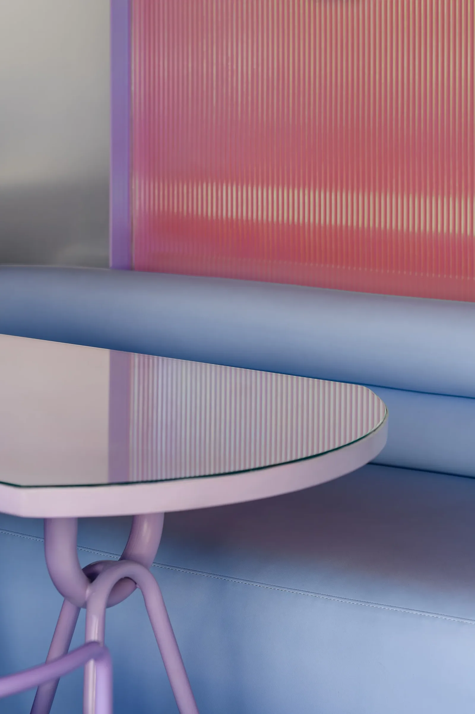 Talkback — Lilac table edge and light-blue banquette
