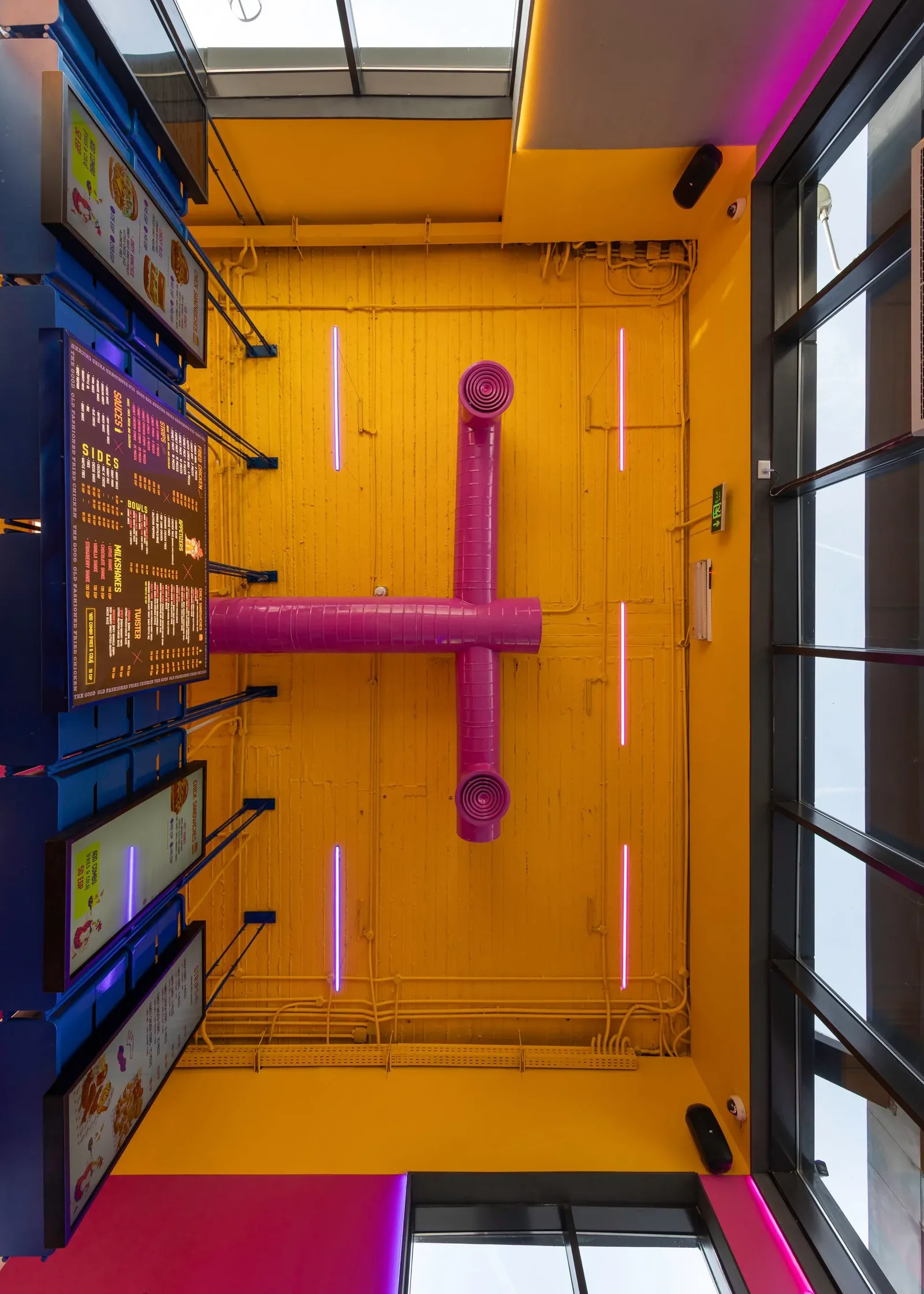 Chick Wink — Ceiling view of the yellow ducts