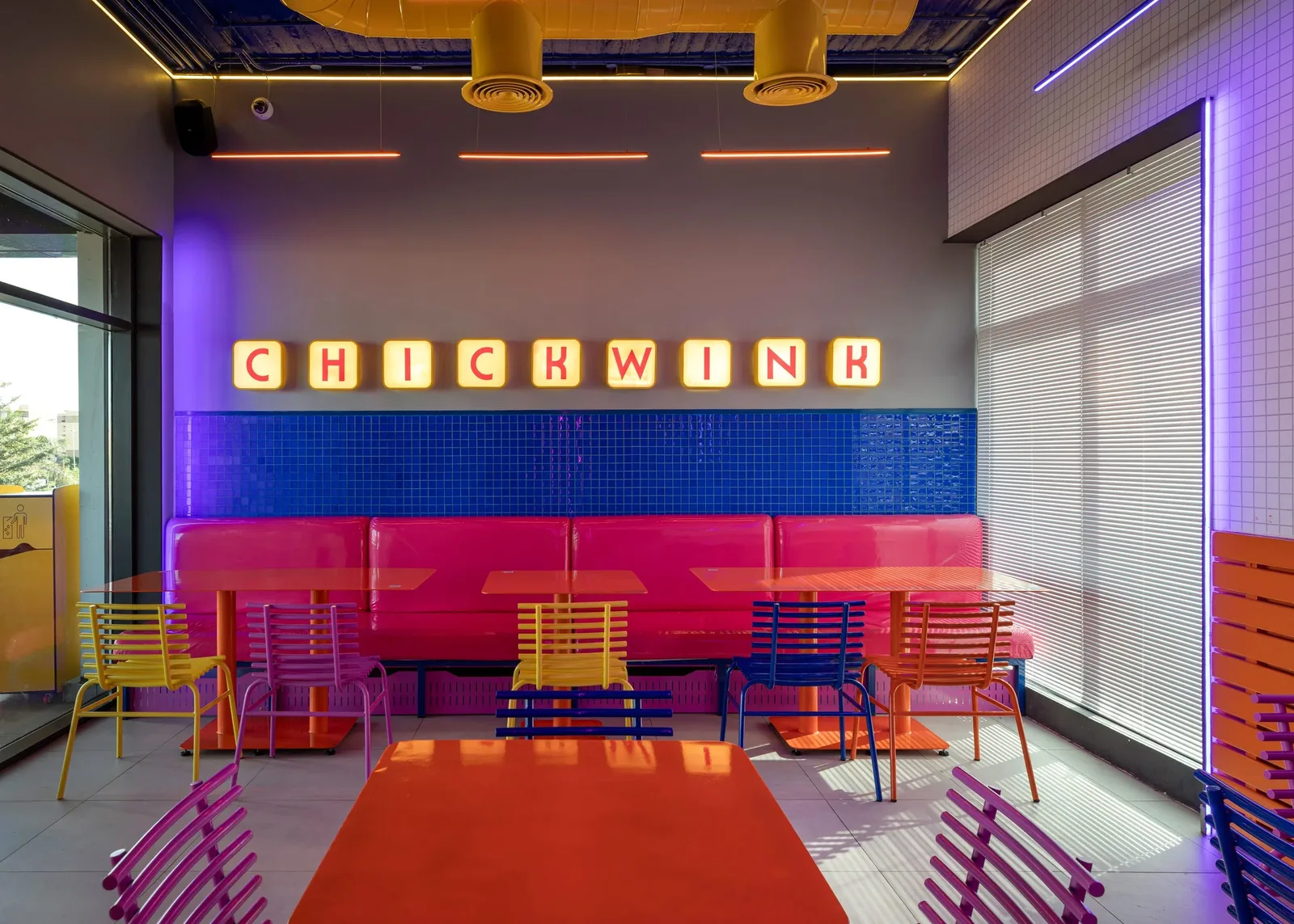 Chick Wink — Dining room with blue tiled banquette