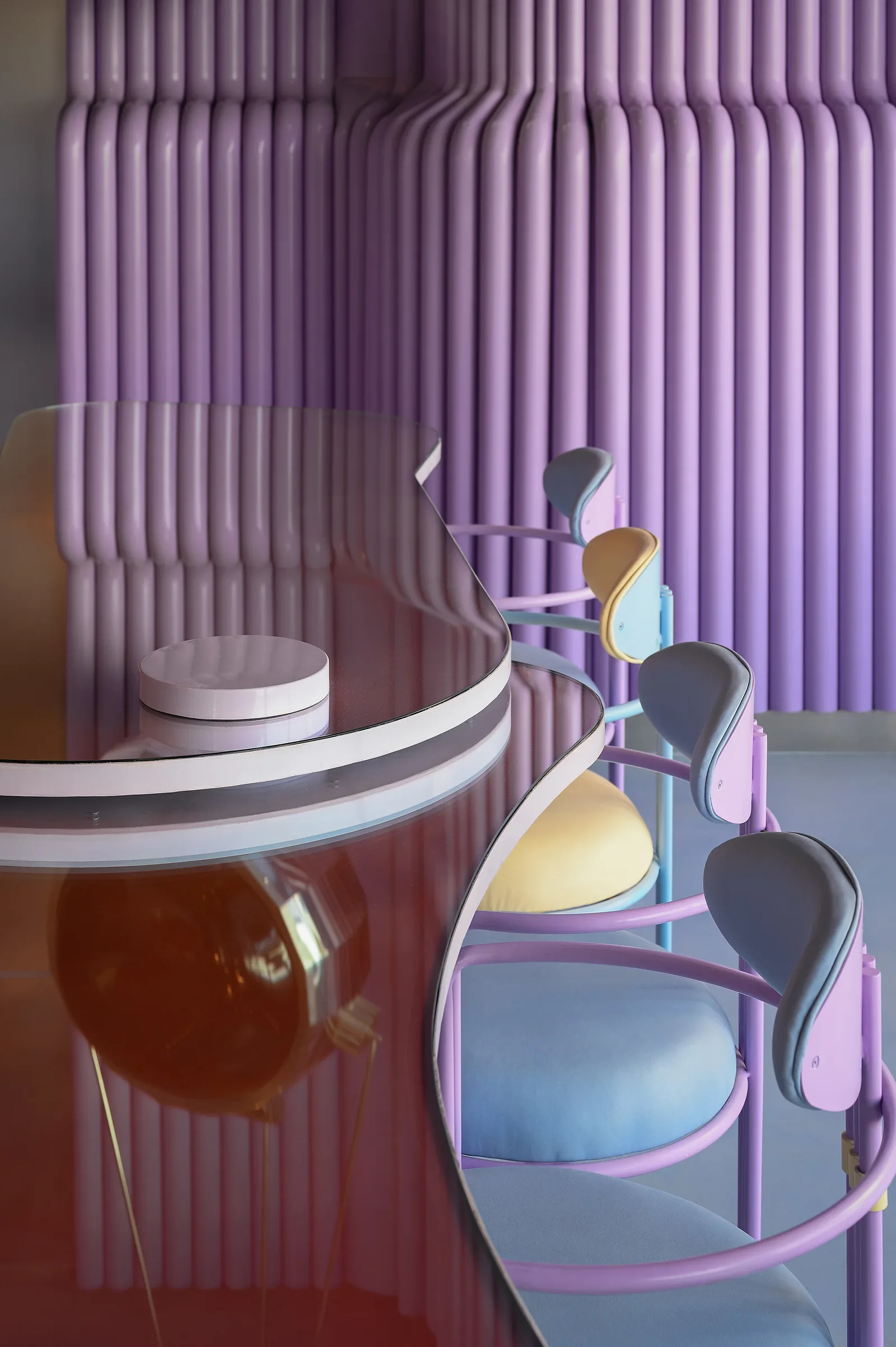 Talkback — Bar stools beside the purple tube wall