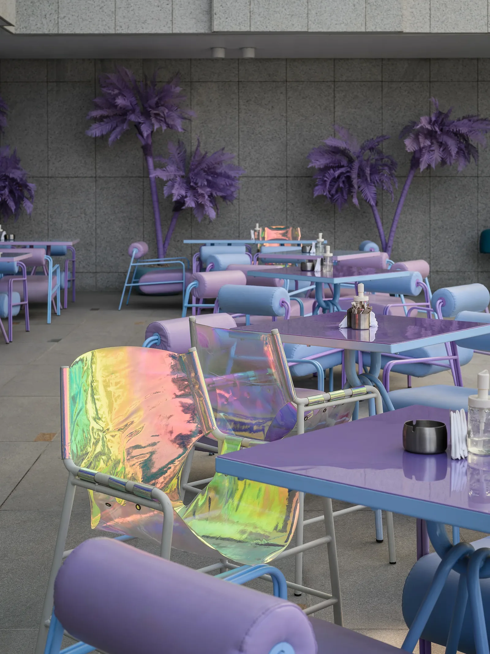 Talkback — Terrace with violet palms and iridescent chairs