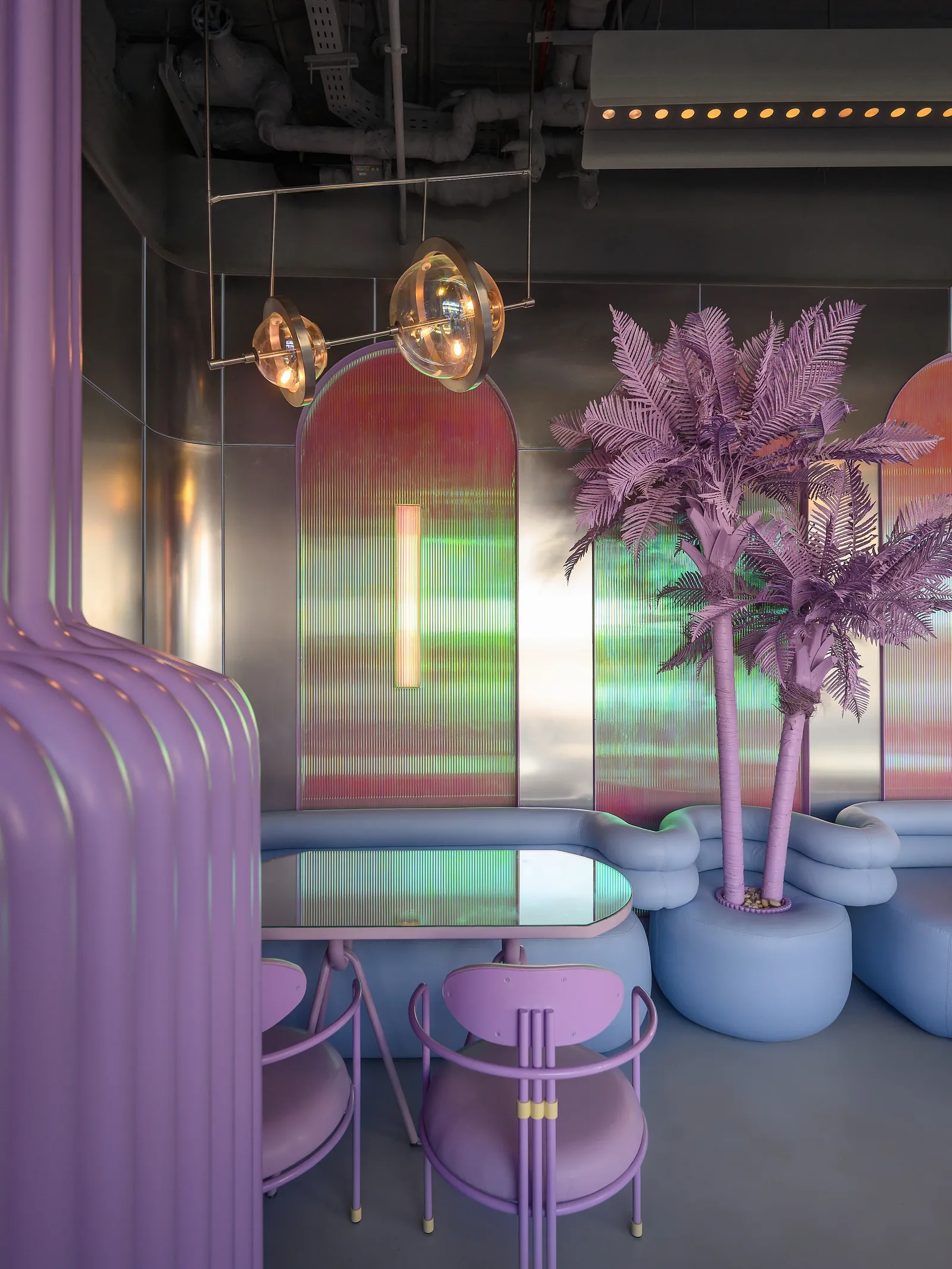 Talkback — Violet palm and arched iridescent panel above the couches