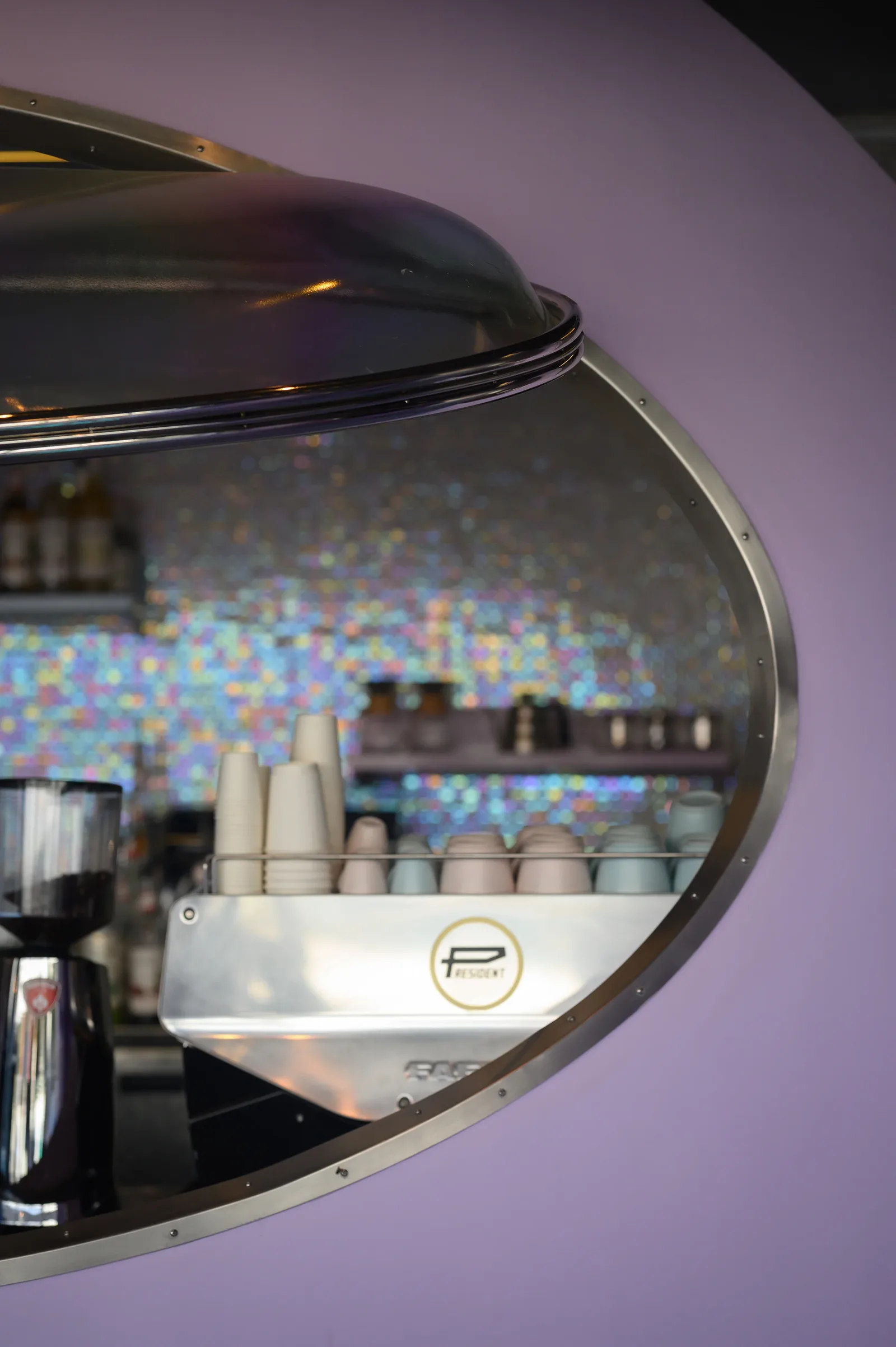 Talkback — Coffee bar through an elliptical opening