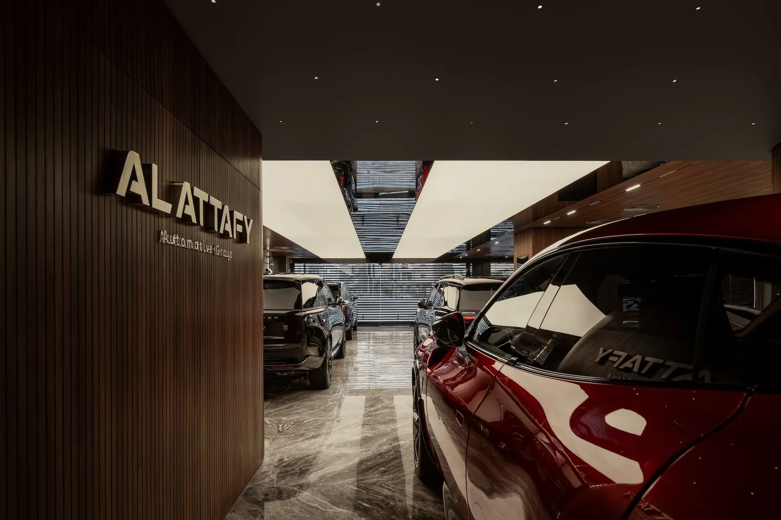 Attafy — Walnut wall with brand lettering