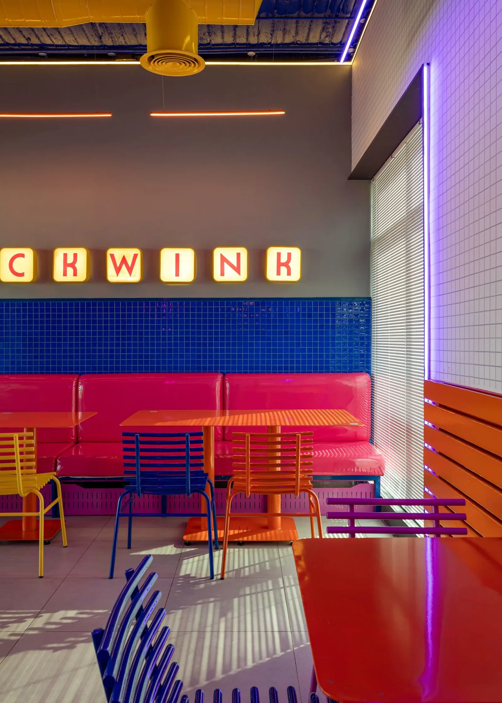 Chick Wink — Banquette beneath the lettered sign