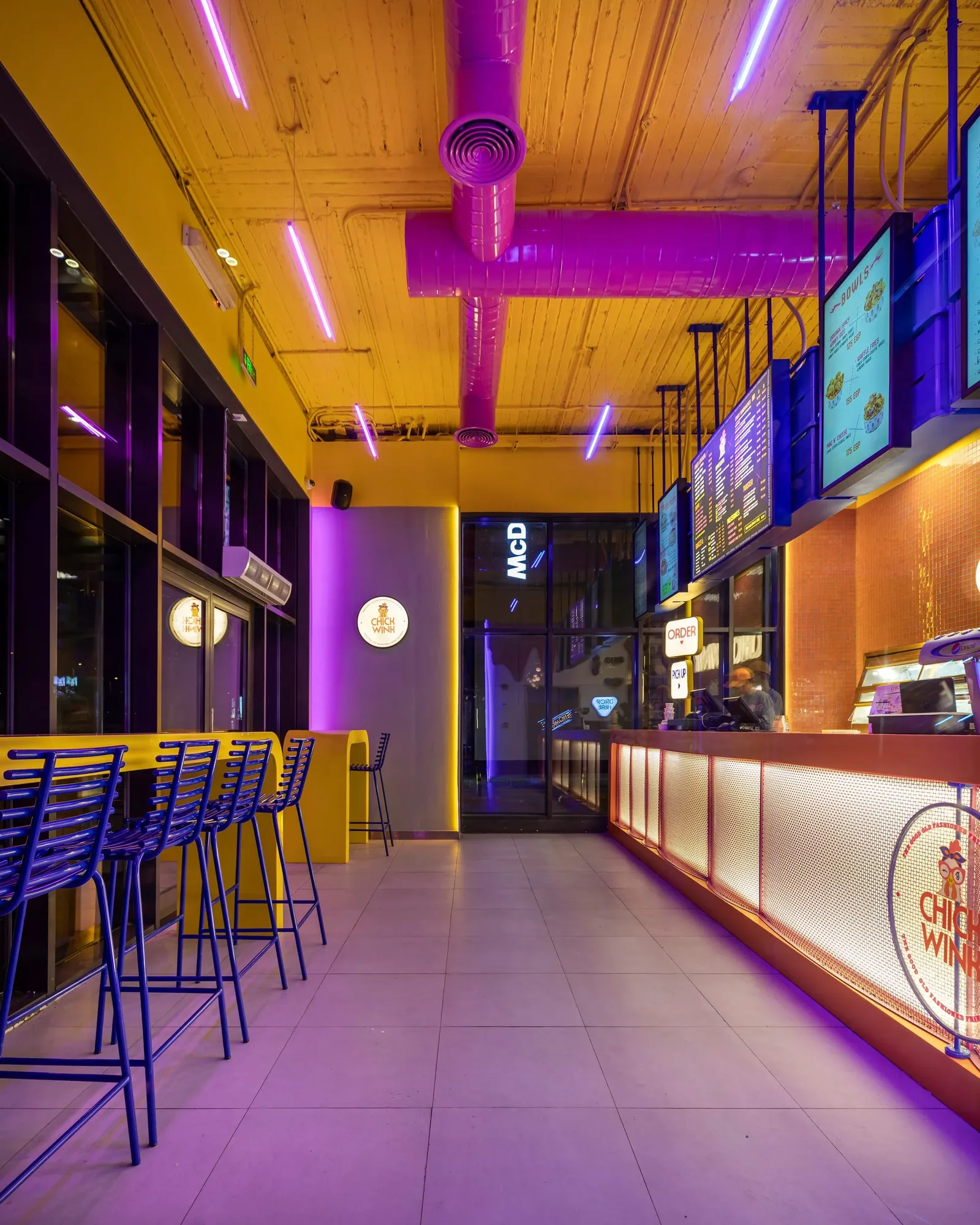 Chick Wink — Counter seating in violet light