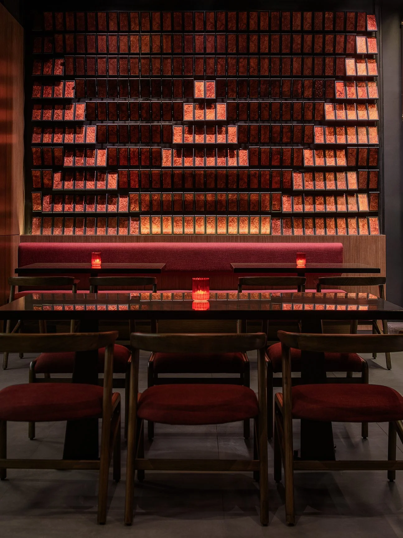 Sushimi By K — Banquette beneath the illuminated tile wall