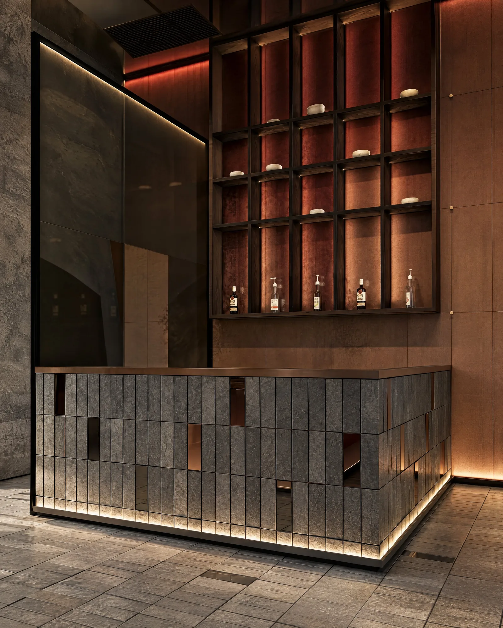Sushimi By K — Bar in stacked stone beneath lit shelving